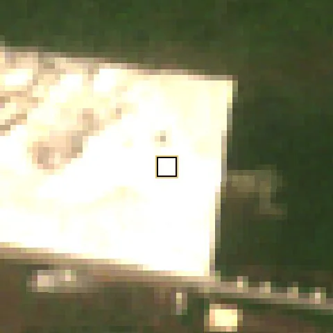 Satellite photo, December 2024: the block around the plot cleared and sand-filled